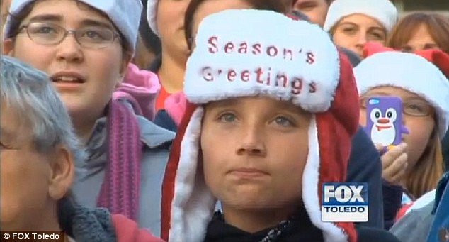 Season's greetings: The celebrations began with a welcome home parade for the teen while Christmas trees and festive lights were put up opposite his bedroom window