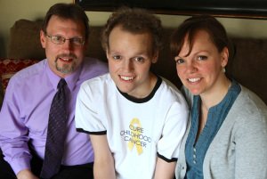 Catholic boy dealing with rare form of bone cancer pictured with parents in Minnesota home