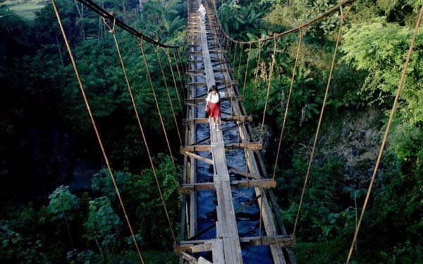 What you see here is a child cautiously walking over planks put on top of aqueducts.